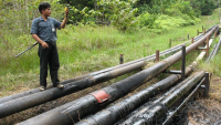  An indigenous monitor visits a spill caused by a pipeline rupture in Oil Block 1-AB near the community of Antioquia.
